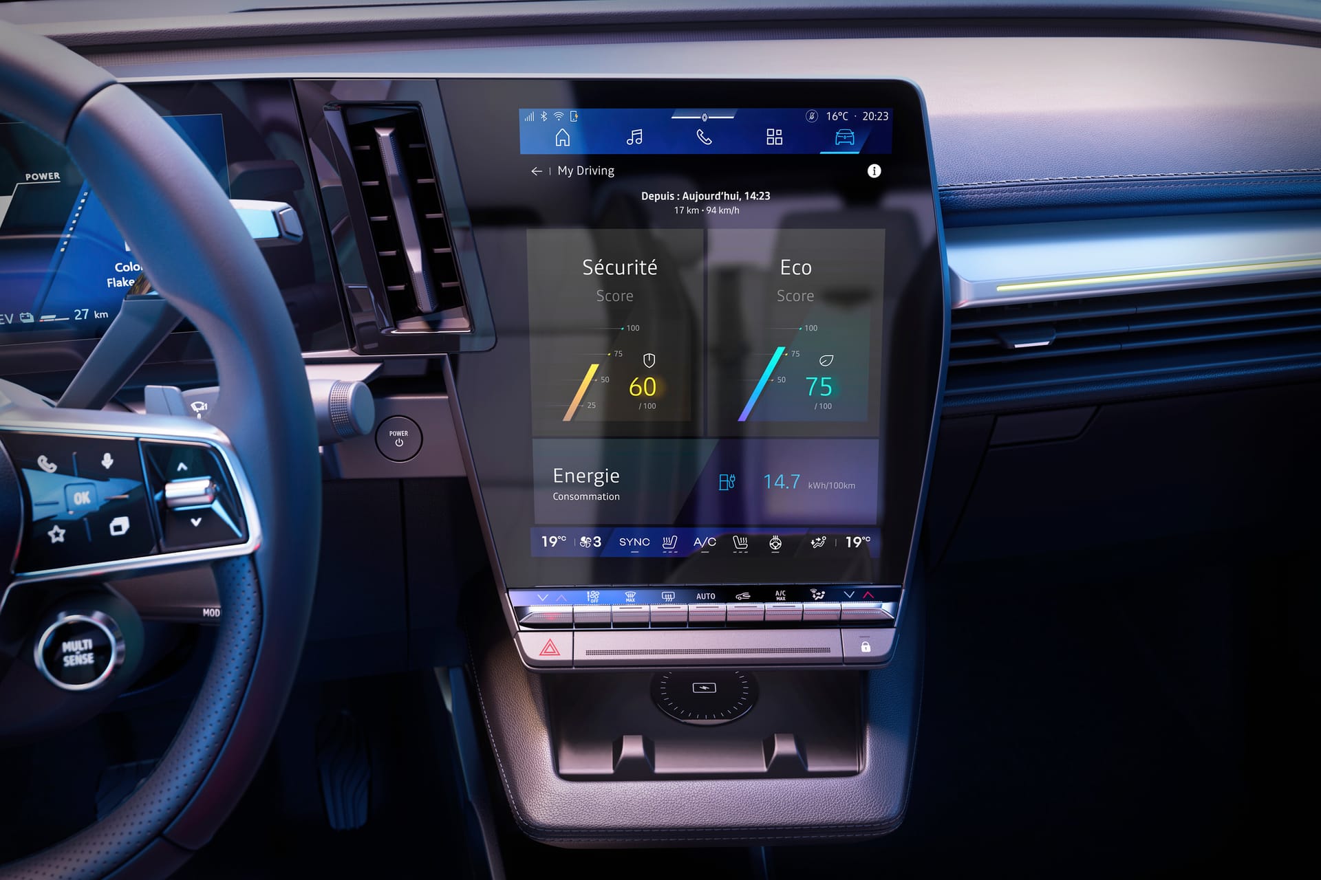 Puesto de conducción del Renault Scenic E-Tech 2026 con el cargador inalámbrico en la consola